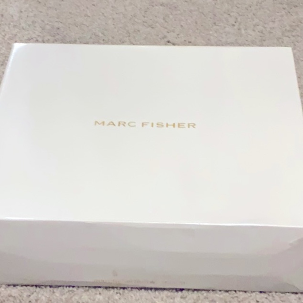 I am selling brand new, grey, suede Marc Fisher over the knee boots.